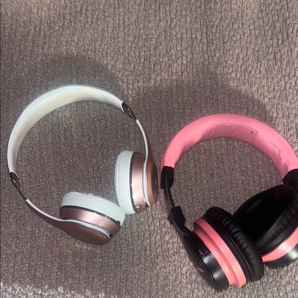 2 pairs of worn headphones.. signs of wear shown in all pics.